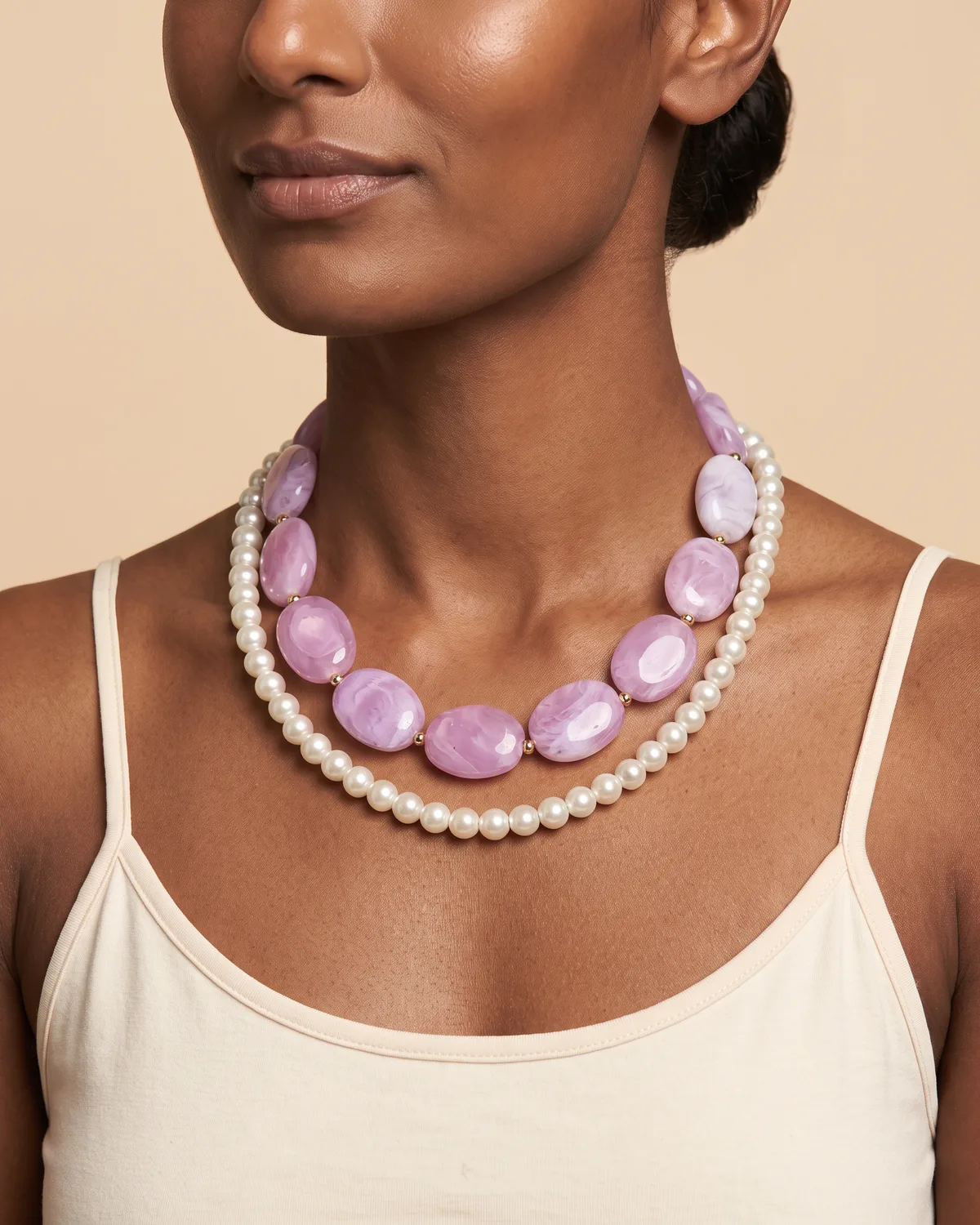 Lavender Cream: a strand of smooth, marbled lavender-pink oval beads paired with a classic strand of luminous white pearls.