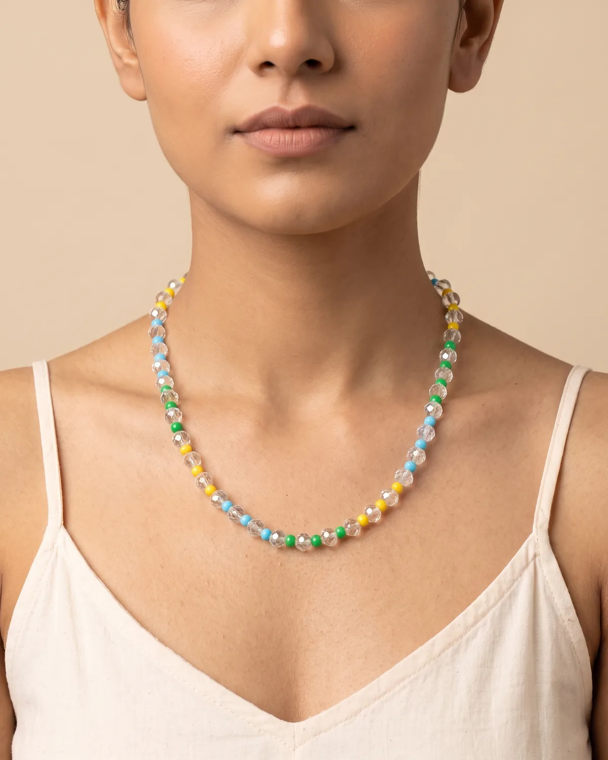Sorbet Splash: a faceted crystal beads interspersed with clusters of small, colorful round accent beads in bright shades of green, yellow, and light blue.